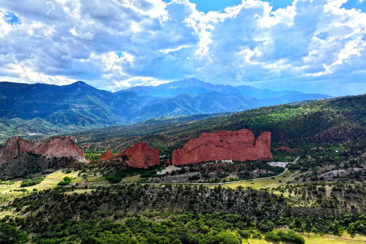 Aerial view of Garden of the Gods red rock formations with Pikes Peak behind