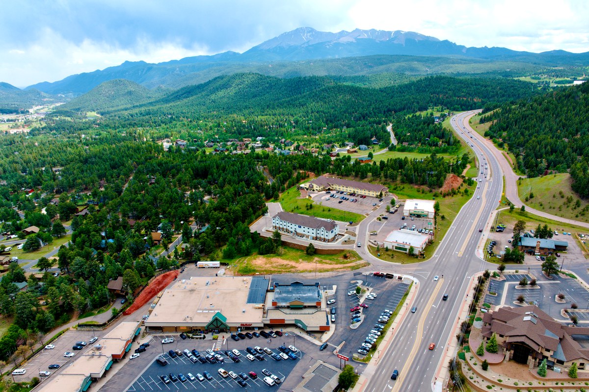 Aerial view of Woodland Park commercial area with Pikes Peak dominating the background