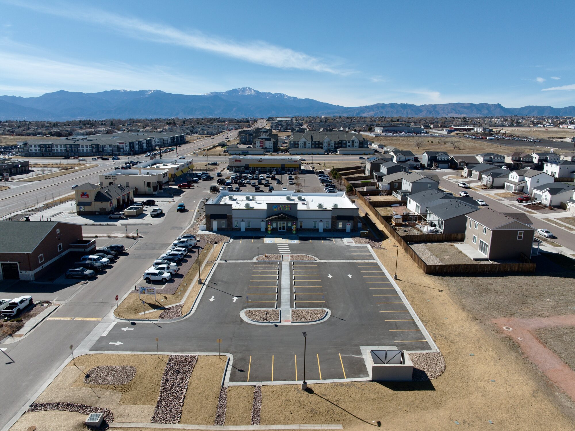 Colorado Springs commercial and residential neighbourhood with Pikes Peak in the background