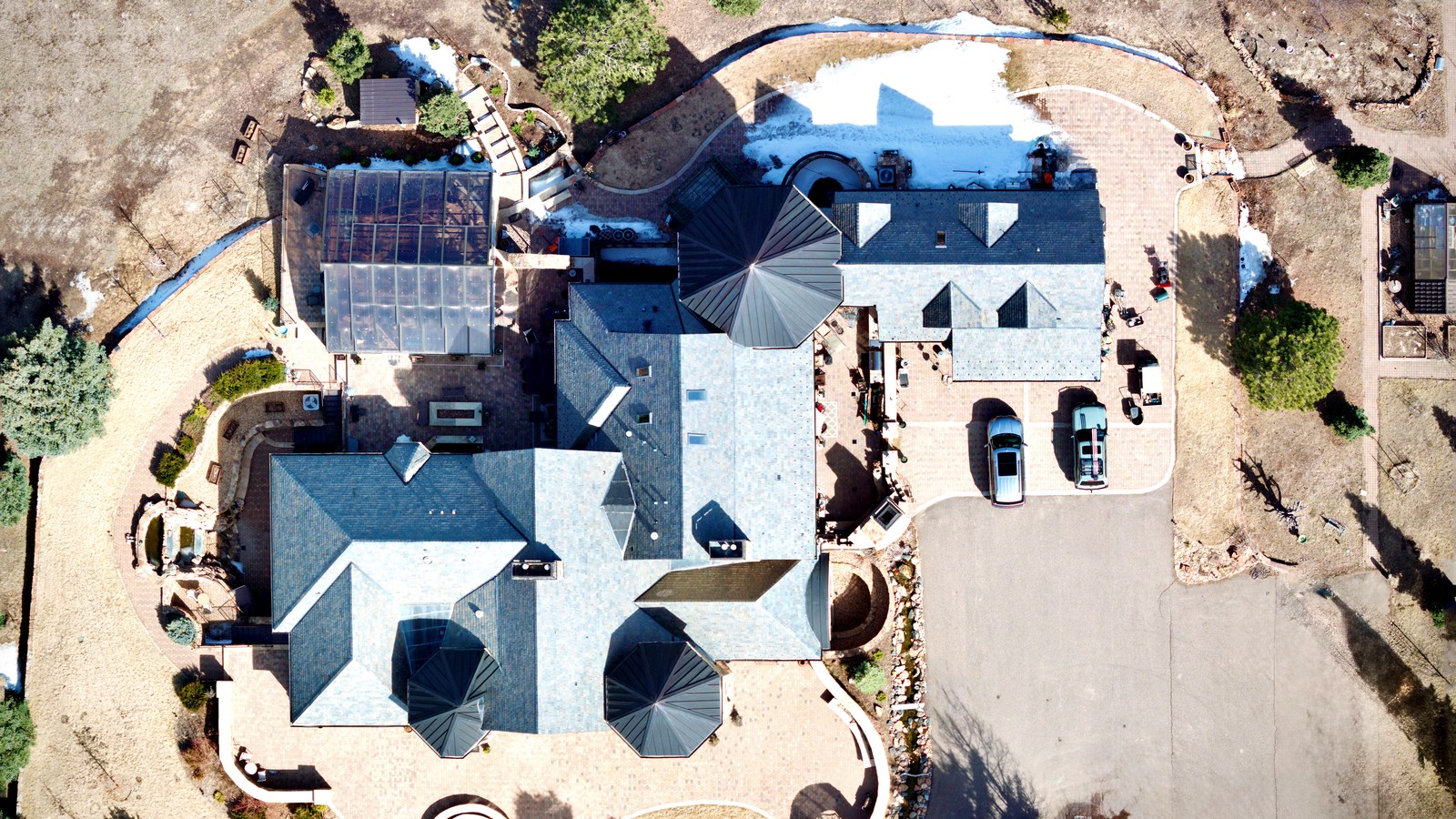 Drone aerial view of a residential roof inspection in Colorado Springs